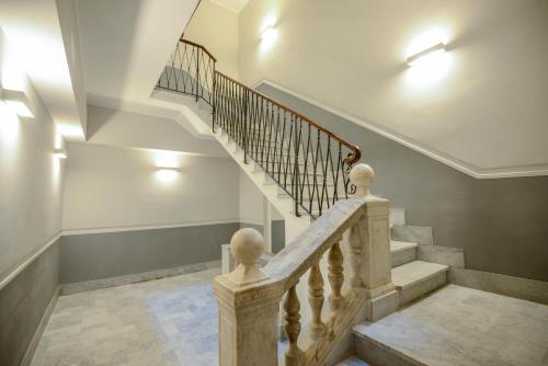 a staircase in a house with lights on it at Attico Centro con terrazza e jacuzzi e parcheggio privati in Genova
