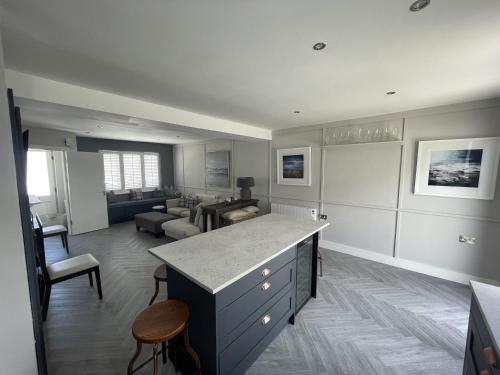 a kitchen with a counter and a living room at 21 Victoria, Kilkee in Kilkee