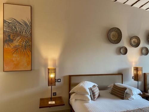 Postel nebo postele na pokoji v ubytování Movenpick Resort Lamantin Saly