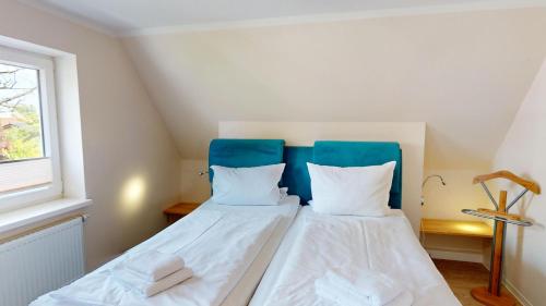 Postel nebo postele na pokoji v ubytování Änne's Hus