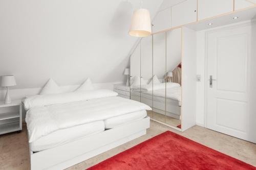 Postel nebo postele na pokoji v ubytování Residenz am Meer 24D Weischer