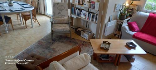 a living room with a couch and a table at MALPAS125 maison 6 chambres 10personnes in Accons