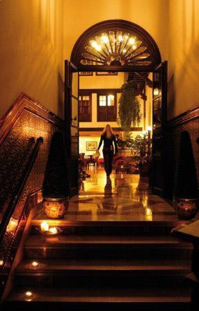a woman walking down the stairs in a building at Hotel Rural Victoria - La Orotava in La Orotava