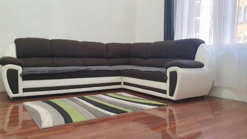 a black and white couch in a living room at Green Panda Apartments in Budapest