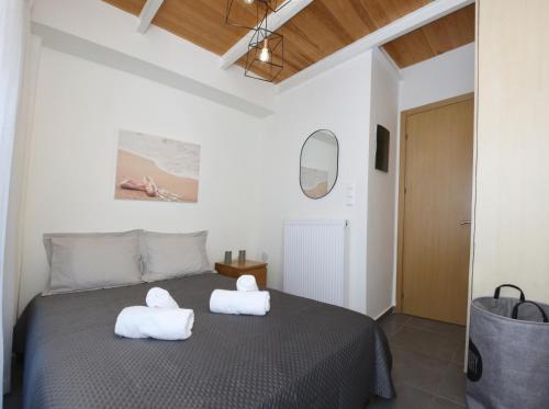 Ένα ή περισσότερα κρεβάτια σε δωμάτιο στο George's Luxury Loft