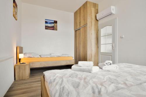 a bedroom with a bed and two bunk beds at Apartmány Děčín in Děčín