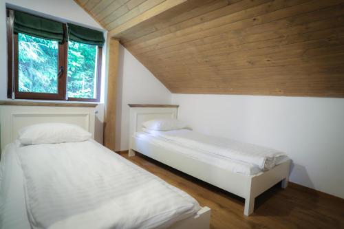 Postel nebo postele na pokoji v ubytování Pensiunea Cheile Albacului