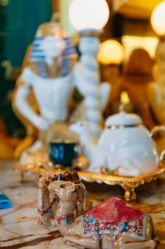 a table with a figurine of a camel on it at Princess Palace in Gdańsk