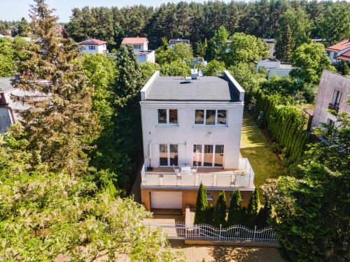 an aerial view of a white house with trees at Princess Palace in Gdańsk