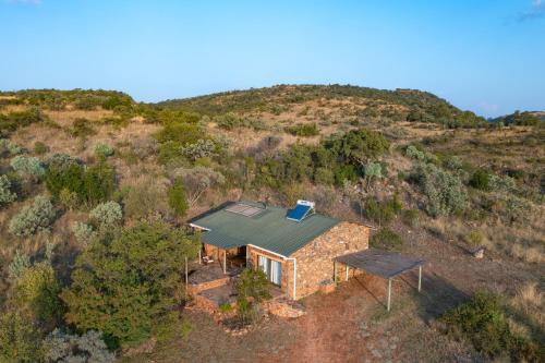 an overhead view of a house on a hill at Kokopelli farm in Magaliesburg