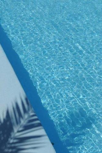 a close up of the water in a swimming pool at Atlantis - by S paradise - outdoor jacuzzi & seaview in Oia