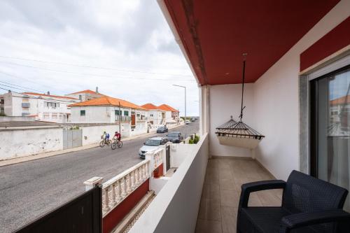 a balcony with a view of a street at West Side Guesthouse in Peniche