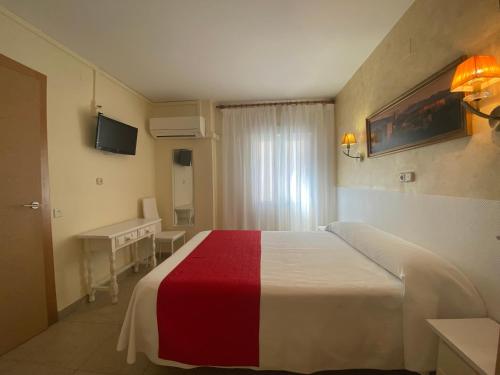 Postel nebo postele na pokoji v ubytování Hostal Sonia Granada