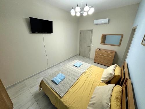 Cama o camas de una habitación en All Nations Duplex with Pool
