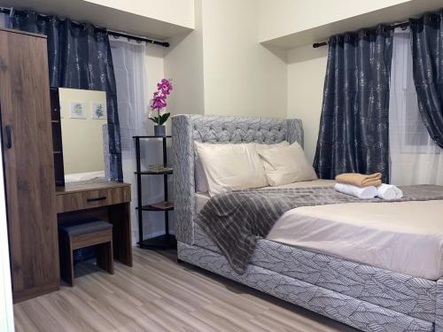Postel nebo postele na pokoji v ubytování Avida Riala 1BR unit- IT Park Cebu City