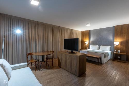TV a/nebo společenská místnost v ubytování Gran Executive Hotel