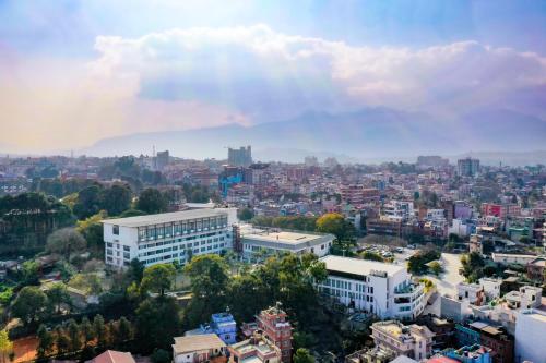 a view of a city with a mountain in the background at Hotel Himalaya in Kathmandu