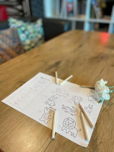 a couple of pencils on a piece of paper on a table at ibis Warszawa Centrum in Warsaw