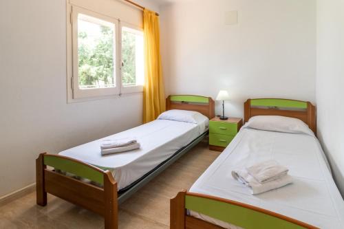 Postel nebo postele na pokoji v ubytování La Farella 60 - Apartamento con balcón