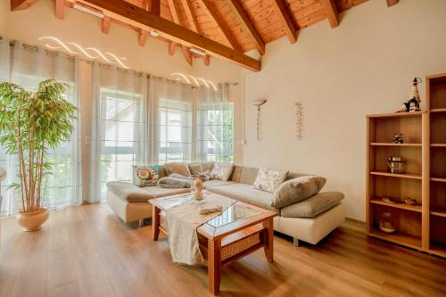 a living room with a couch and a table at Haus Emanuel in Weilerbach