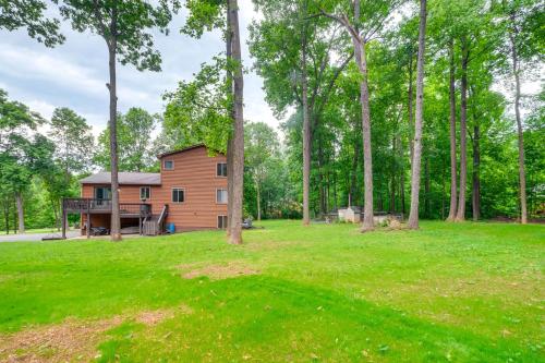 a house in the middle of a field with trees at Linden Family Home with Yard Less Than 5 Mi to Wineries! in Front Royal