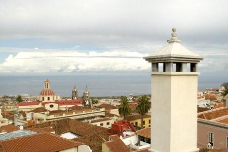 a view of a city with a white tower at Hotel Rural Victoria - La Orotava in La Orotava