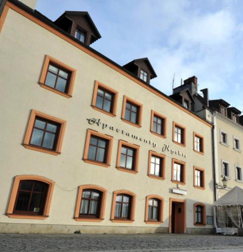 a building with the words kyrgyz university hospital at Apartamenty Nyskie in Zgorzelec