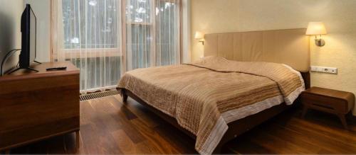 Ένα ή περισσότερα κρεβάτια σε δωμάτιο στο Jūros apartamentai 567