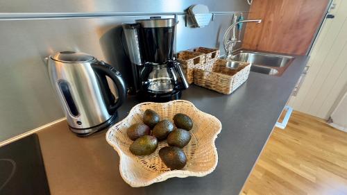 a basket of eggs on a counter in a kitchen at Orcas View Vestresand Lofoten in Bøstad