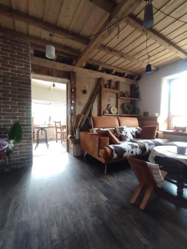 a living room with a bed and a table at Chambre atypique 2 pers 200m du lac in Saint-Jorioz