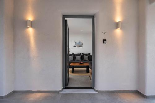 a hallway with a door leading to a living room at LyMaRou Collection in Megalokhori