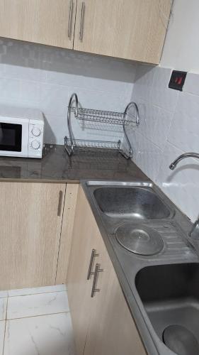 Η κουζίνα ή μικρή κουζίνα στο The Greenzone Apartments,Kiambu Road