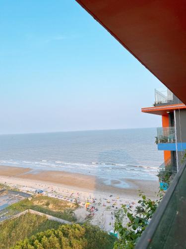 a view of a beach with people in the water at Ibiza Hai Tien IB1226 in Thanh Hóa