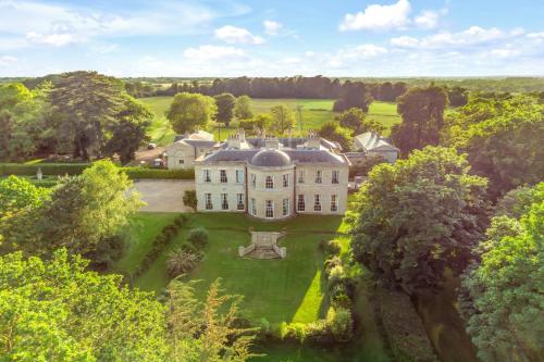 an aerial view of a large estate with trees at Must see - Georgian Mansion I Suffolk Retreat in Beccles