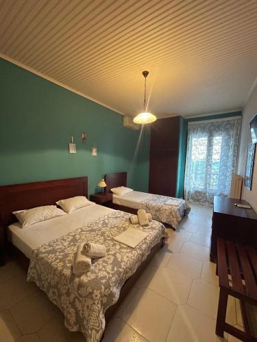 Ένα ή περισσότερα κρεβάτια σε δωμάτιο στο Nirvana Hotel