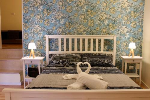a bedroom with a bed with a stuffed animal on it at Centro storico Bed and Breakfast in Vico del Gargano