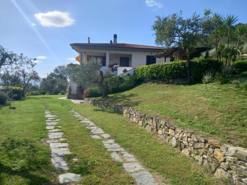 a stone path in front of a house at Il Colle della Brina in Sarzana