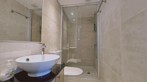 a bathroom with a toilet and a sink and a shower at STAY Akoni House in Droushia