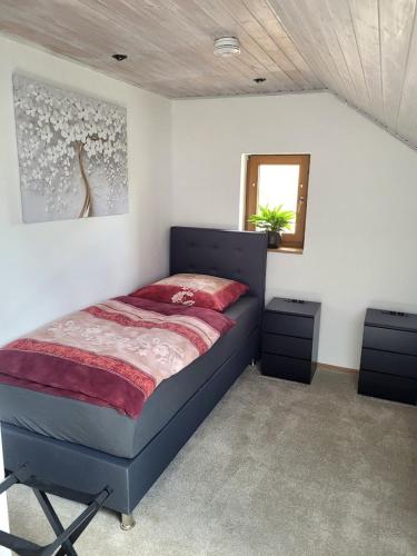 a bedroom with a bed and a mirror at 75qm Apartment in Burgstaedt