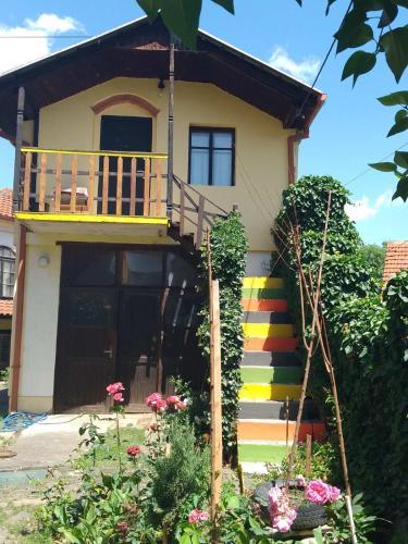 a house with a rainbow staircase in front of it at Garičkina kuća 2 in Pirot