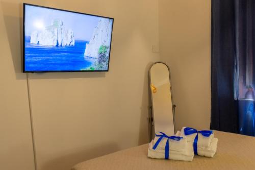 TV a/nebo společenská místnost v ubytování Casa Vacanza IgleHouse
