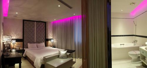 Posteľ alebo postele v izbe v ubytovaní Hsiangkelira Hotel