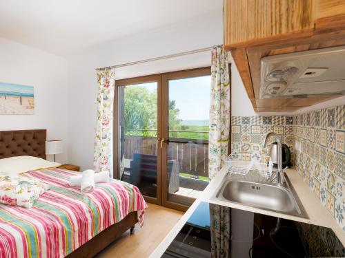 Kuchyň nebo kuchyňský kout v ubytování Hotel Aparthotel Baltic Willa