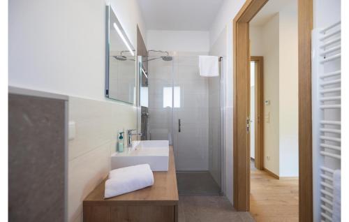 a bathroom with a white sink and a mirror at Villa Mit Pool In Stegersbach in Neudauberg