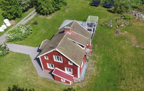 an overhead view of a red barn in a field at 4 Bedroom Stunning Home In Närkesberg in Närkesberg