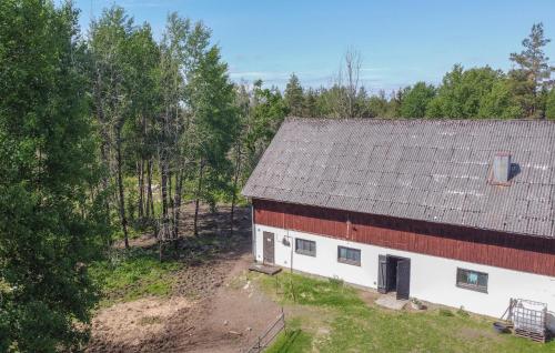 an aerial view of a red and white barn at 4 Bedroom Stunning Home In Närkesberg in Närkesberg