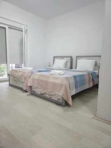 Un pat sau paturi într-o cameră la Vila Snezana