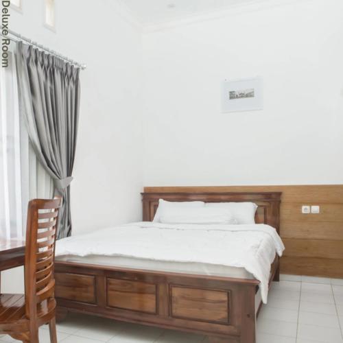Ένα ή περισσότερα κρεβάτια σε δωμάτιο στο DD House Malang
