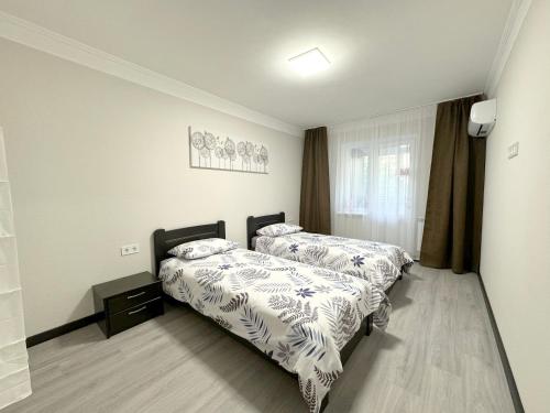 Ένα ή περισσότερα κρεβάτια σε δωμάτιο στο ARTAL Apartment on Obolonskyi Avenue 16