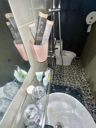 a bathroom with a sink and a toilet at Maria Hotel in Ba Tri